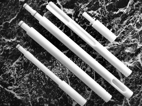 White bore guides on black marble background